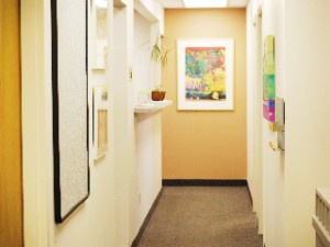 Warm, brightly-lit office hallway